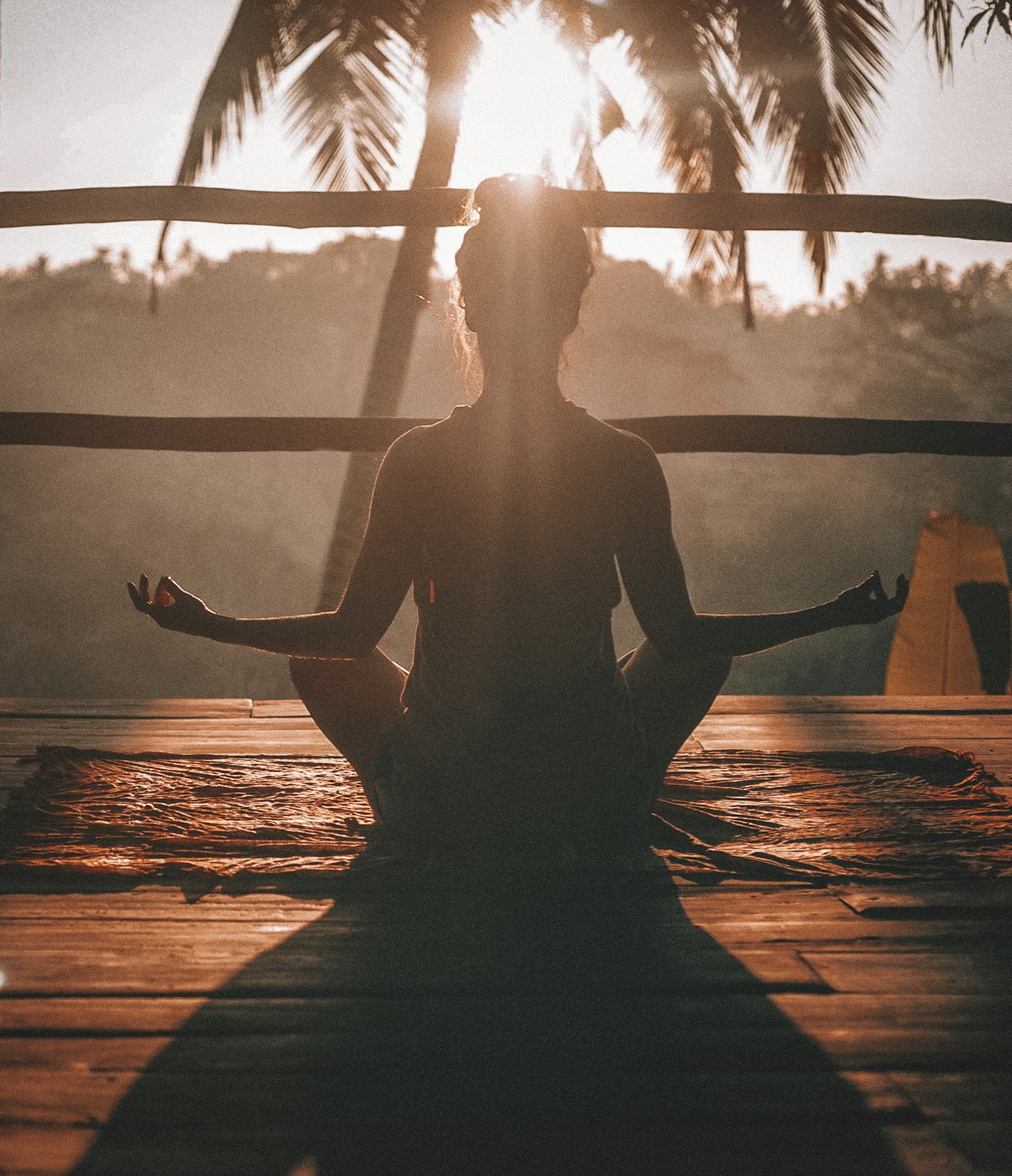 Person meditating peacefully outdoors after protecting their energy